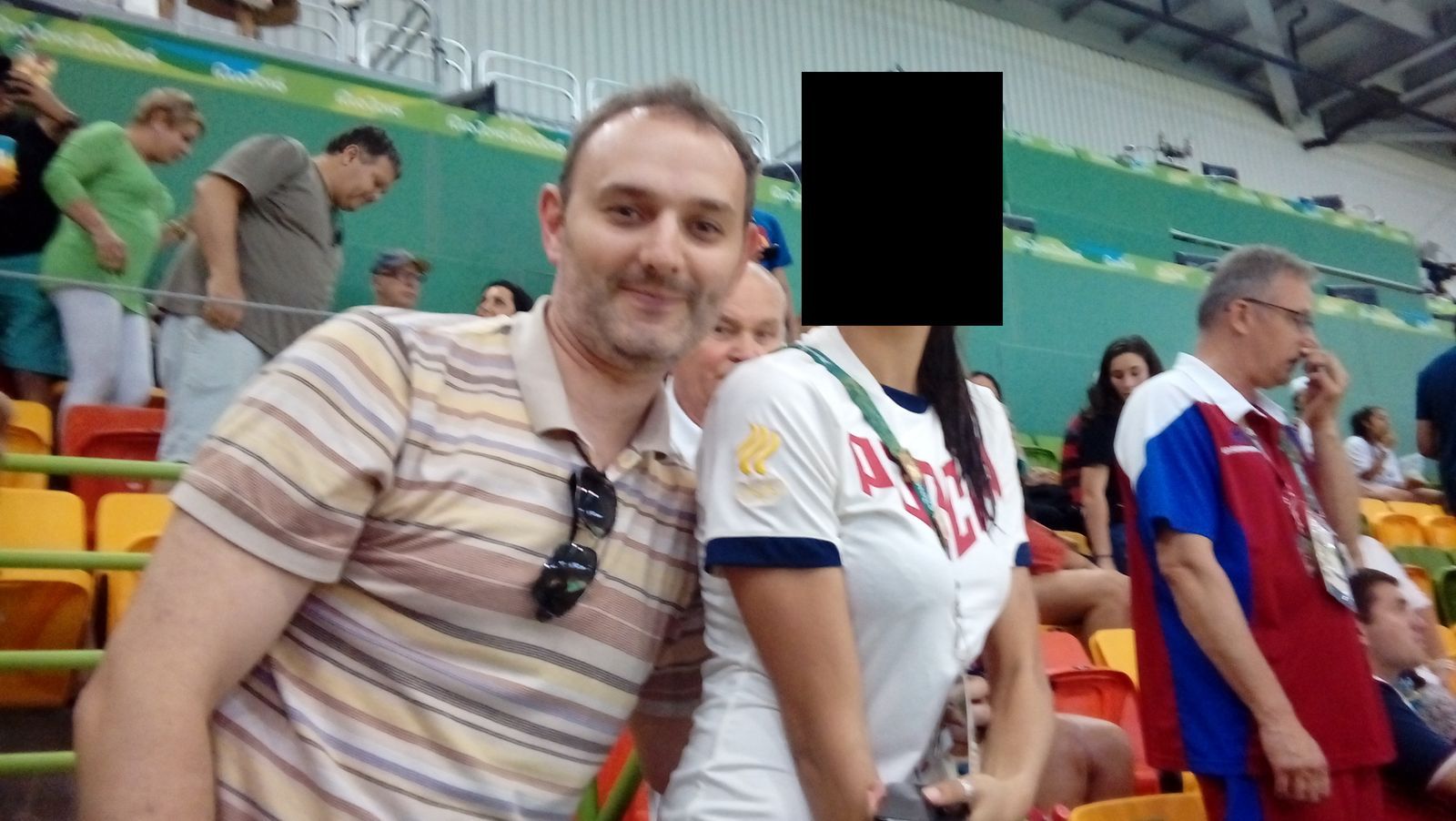 EVGENII MIKHAYLOVICH SEREBRIAKOV posing with someone whose face has been blurred