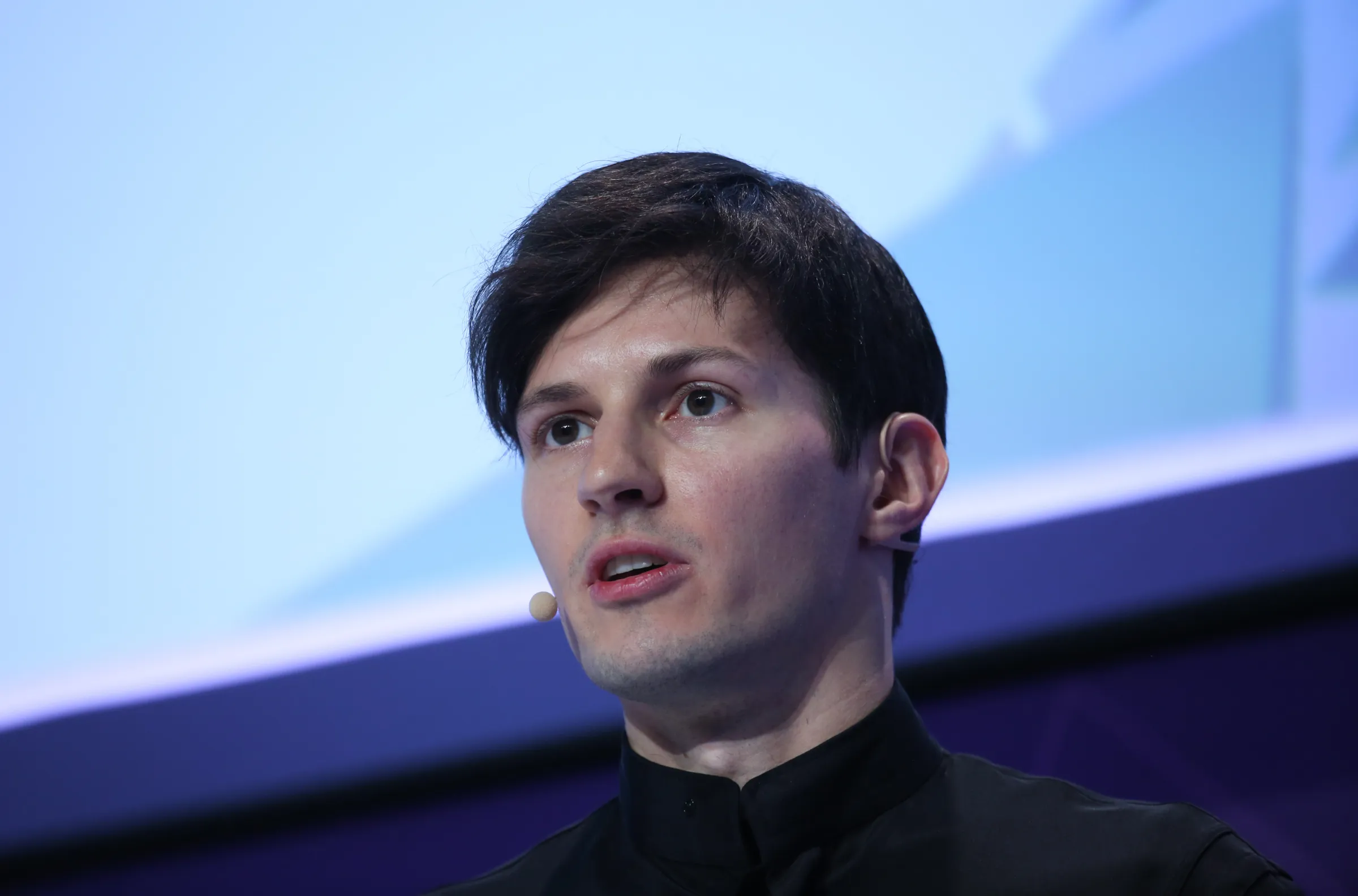 Photo illustration of Telegram CEO Pavel Durov with the Telegram logo.