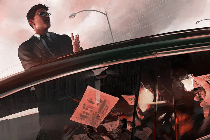Man standing up in a car through a sunroof during a protest