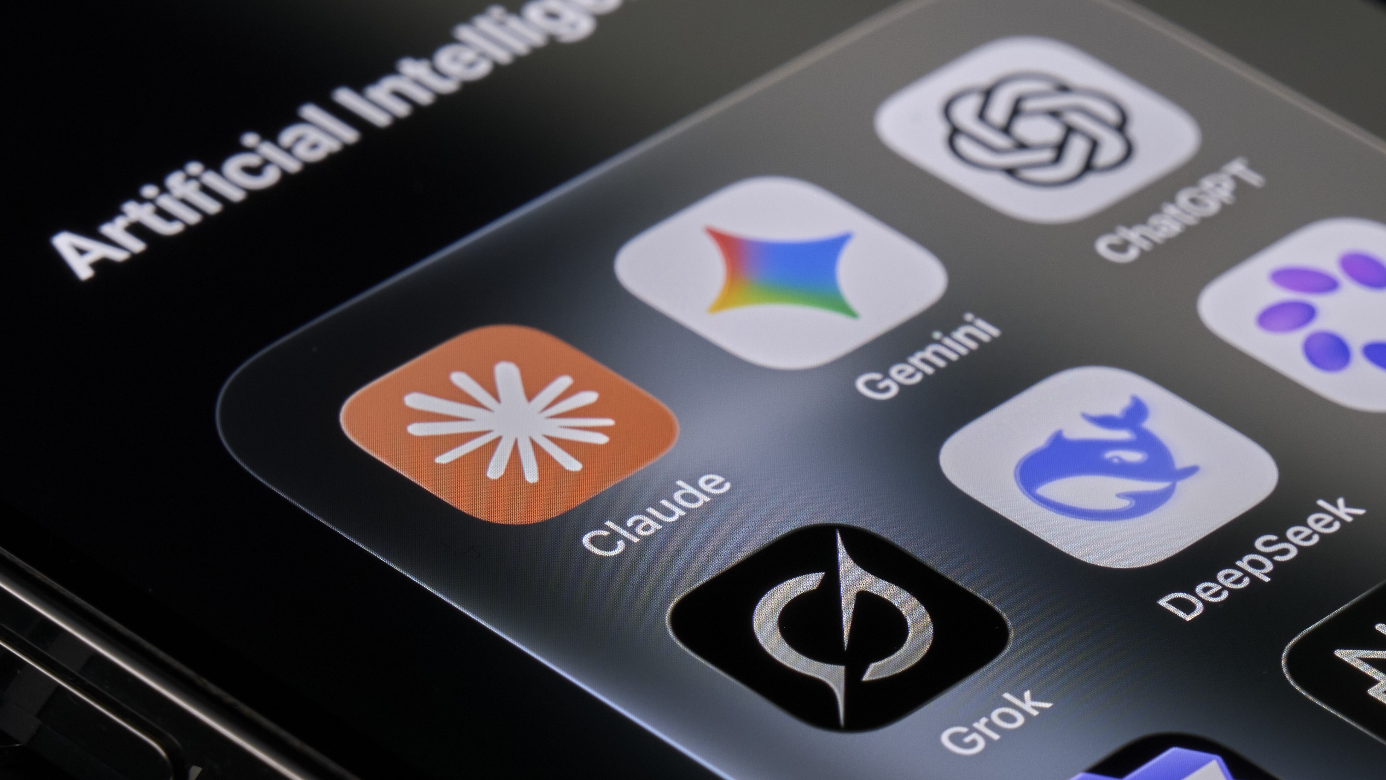 The Claude app on a smartphone alongside other AI services
