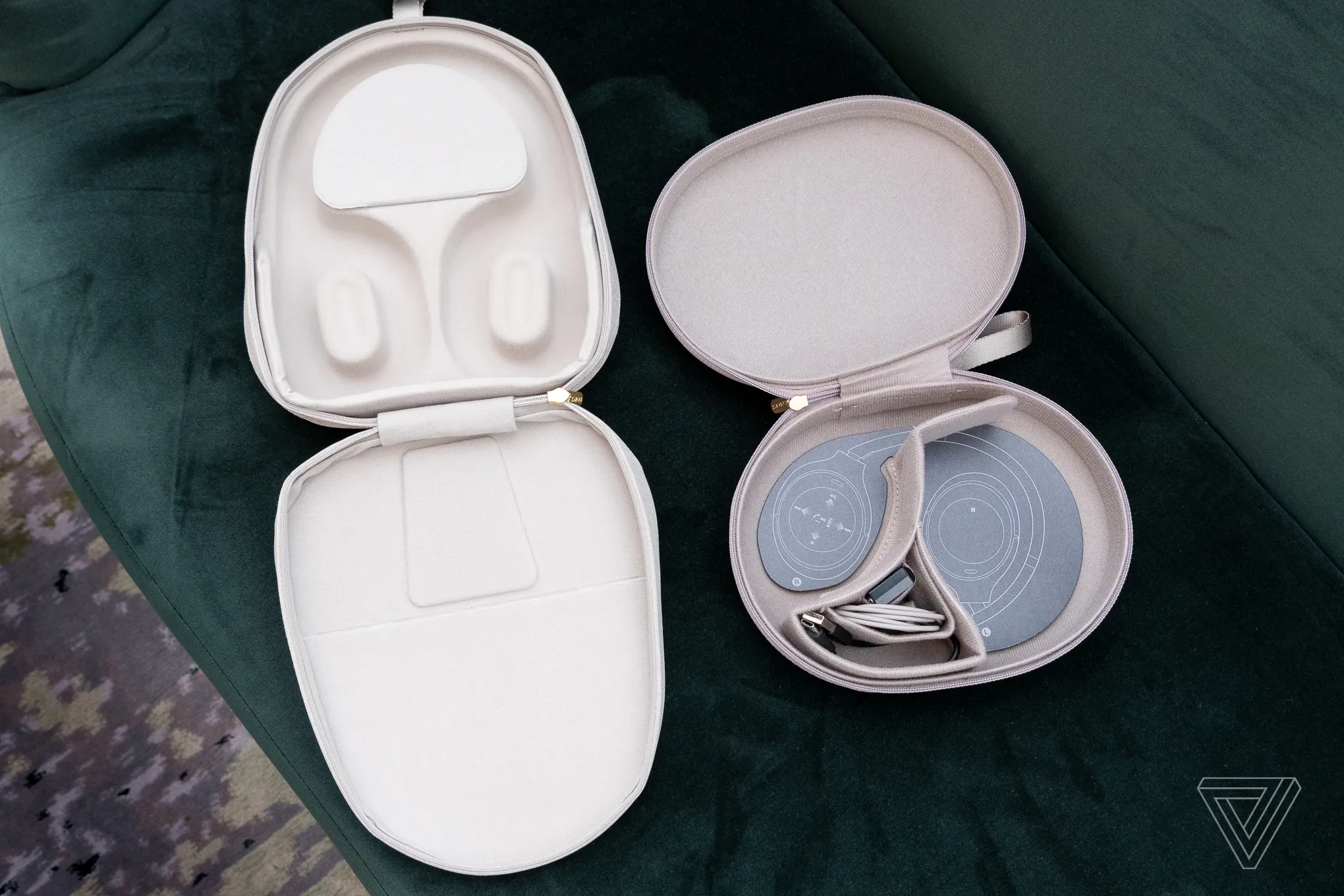 A person taking the silver-colored Sony WH-1000XM5 headphones out of their tan leather purse.
