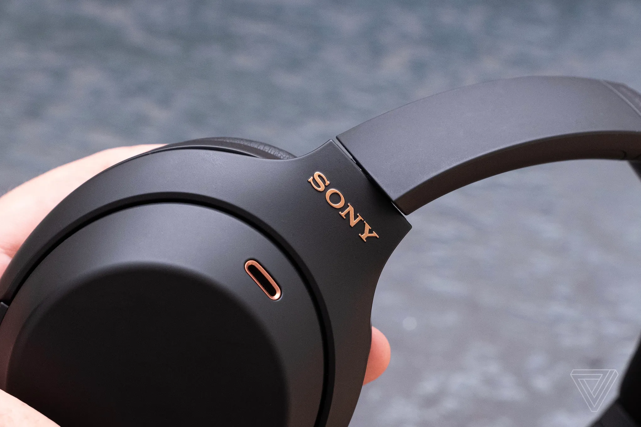 A photo of Sony’s 1000XM4 noise-canceling headphones on someone’s head.