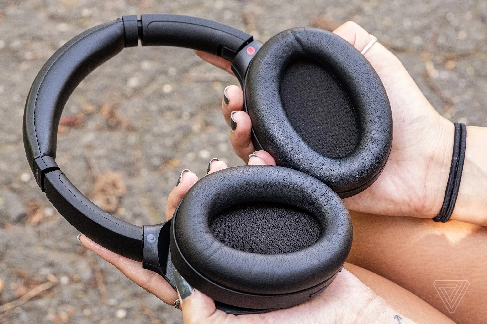 A photo of Sony’s WH-1000XM4, the best noise-canceling headphones for most people, resting on a table.