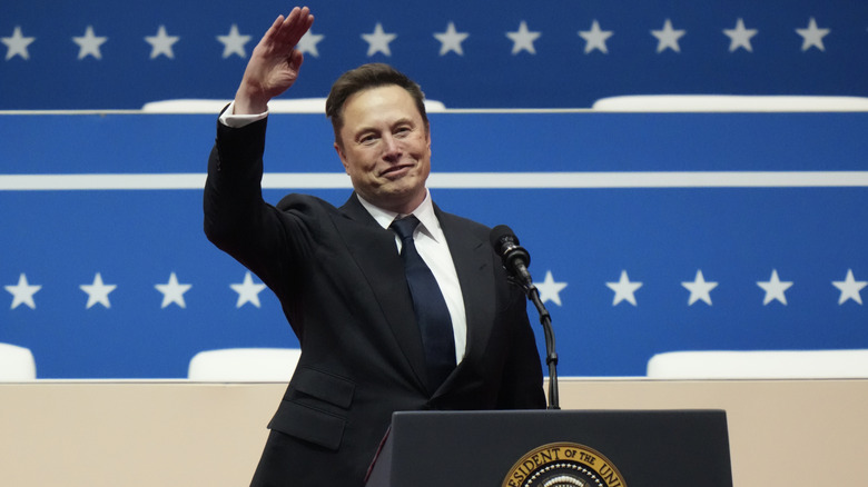 Elon Musk gesturing at Donald Trump's 2026 inauguration.
