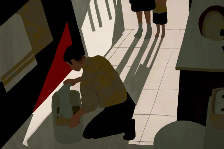 An giant empty computer dominates a pair of people looking lost at its base.